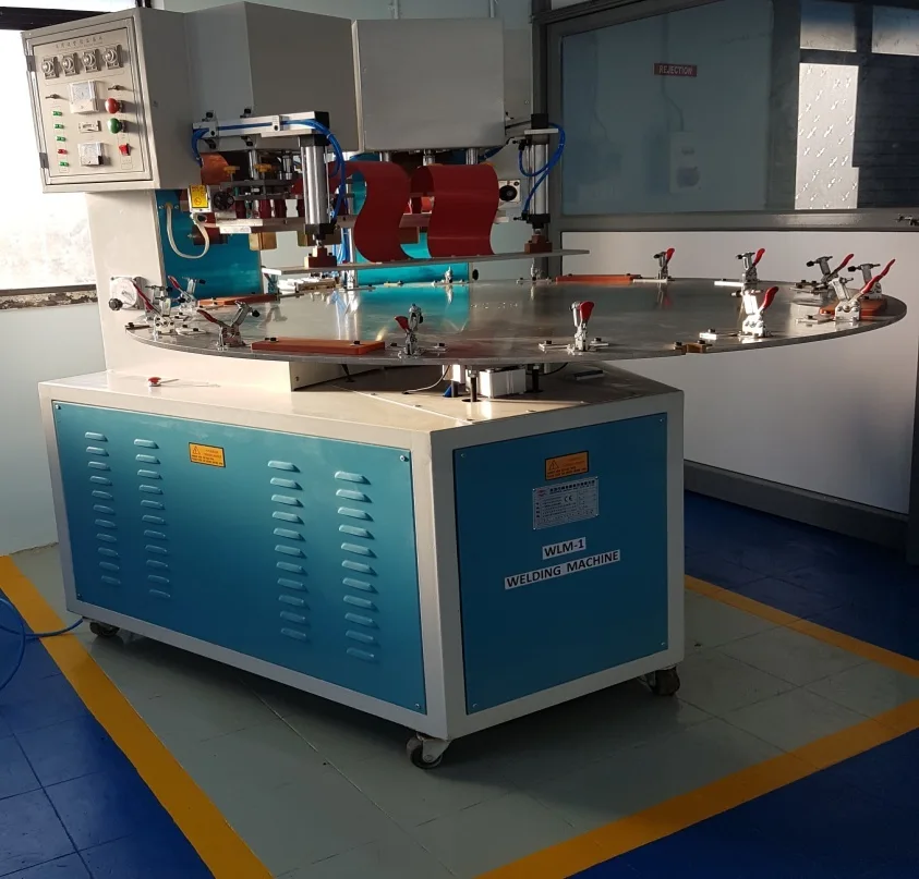 Rotary-table high-frequency welder with toggle clamps